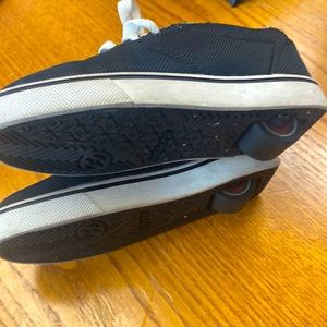 Like new. Never used.  Kids Heelys.  Size YTH 1